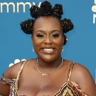 Makiah Green attends the 74th Primetime Emmys with gold wrapped bantu knots