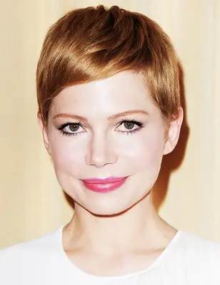Michelle Williams with short, red hair
