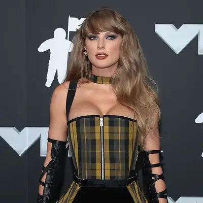 Taylor Swift with full side bangs and dark blonde hair at the 2024 MTV Video Music Awards in Elmont, New York
