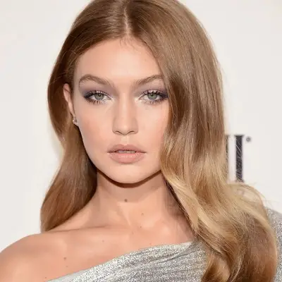 Gigi Hadid with caramel blonde hair at the Daily Front Row 2018 Fashion Media Awards in New York City 