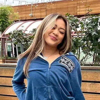 Suni Lee with ash blonde and brown hair 