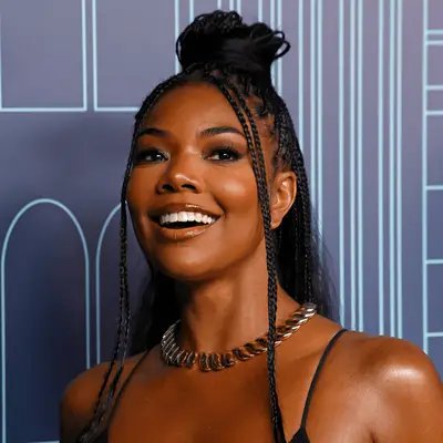 Gabrielle Union wearing knotless braids in a half-up, half-down style