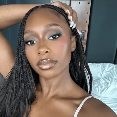 renee downer with straight knotless braids