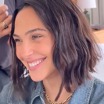 Woman with a short blunt bob with dark brown hair