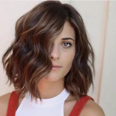 tousled lob with strawberry brown color