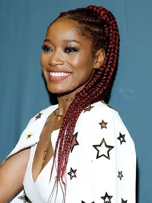 dark red hair colour: Keke Palmer with red braids