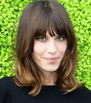 Alexa Chung with mid length hair with long fringe