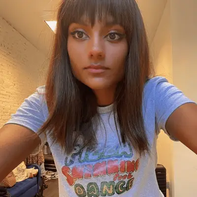 Simone Ashley with bangs and mid-length hair