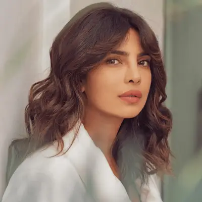 Prihyanka Chopra with tousled mid-length hair and feathered curtain bangs