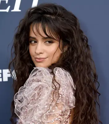 Camila Cabello wispy bangs and long curly hair