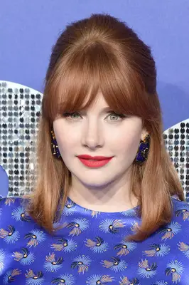 Bryce Dallas Howard mod bangs in purple patterned dress