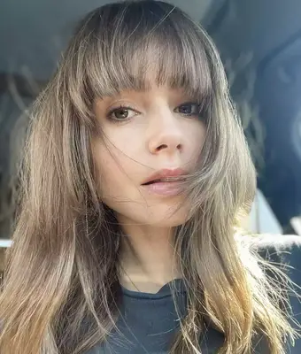 Lily collins with fresh fringe in black shirt