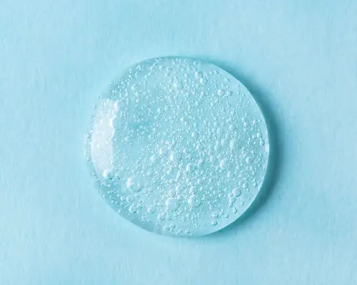 drop of clear gel on blue background