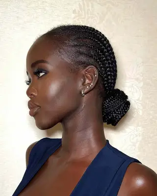 model adut aketch with straightback braids