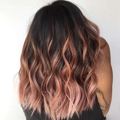 rose gold balayage with dark roots and light ends