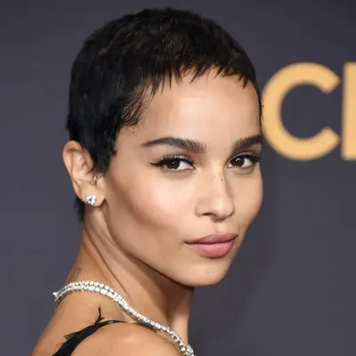 Zoe Kravitz wears a short pixie cut with micro fringe