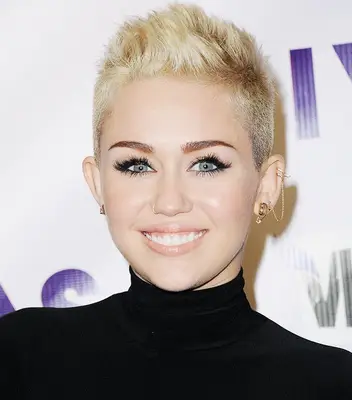 Miley Cyrus wears a short faux-hawk pixie cut hairstyle