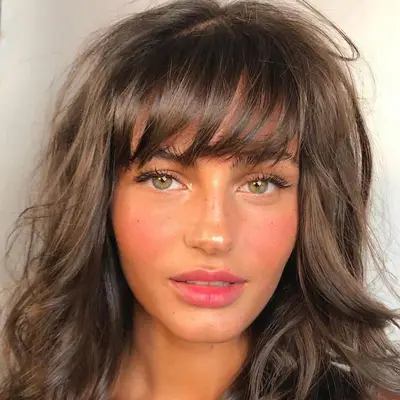 Woman with a tousled blowout with 