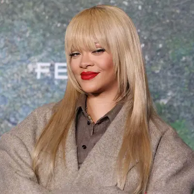 Rihanna with long blunt bangs and face-framing layers 