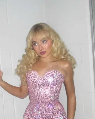 Sabrina Carpenter with retro bangs and curls 