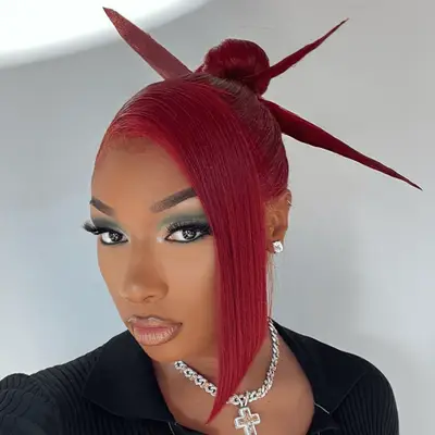 Alessandra Ambrosio with a slicked-back hairstyle and minimal makeup at the 2022 theOMEGA 