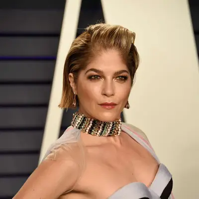 Selma Blair with a coiffed slicked-back hairstyle at the 2019 Vanity Fair Oscar Party in Beverly Hills, California