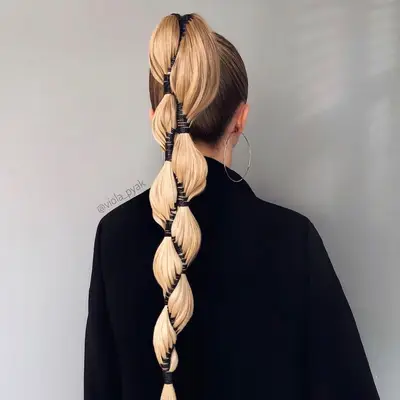 Back view of blonde banded double ponytail hairstyle