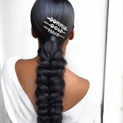 Megan Thee Stallion wears an ultra-long, winding ponytail braid