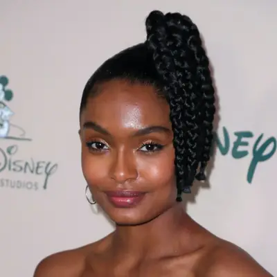 Yara Shahidi wears a short high ponytail in multiple braided sections