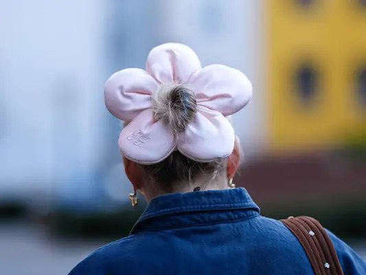 Woman wearing a flower-shaped scrunchie