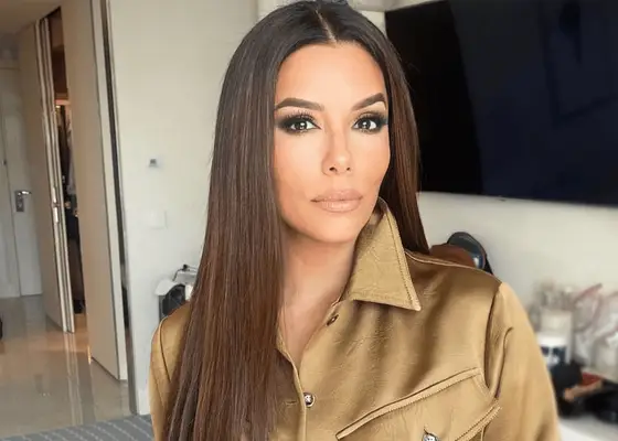 eva longoria selfie wearing long brunette hair and trench coat