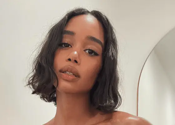 close up of laura herrier with undone bob on white background