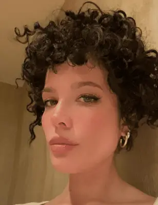Singer Halsey with short, curly hair