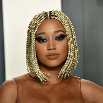 Amandla Stenberg wears a platinum blonde box braided bob hairstyle