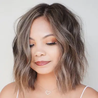 Woman with mushroom brown bob haircut