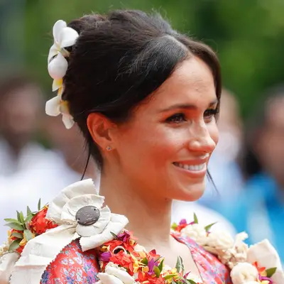 Meghan Markle wearing updo with floral accessories