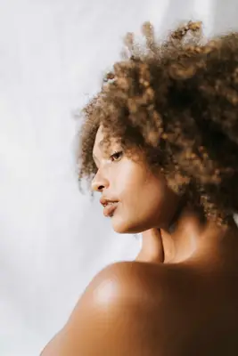 Profile of woman with curly hair