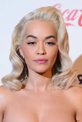 Rita Ora retro glam waves with volumized roots