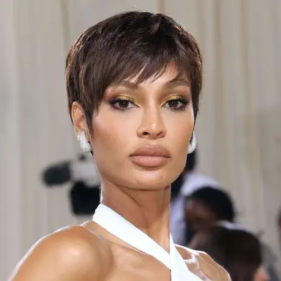Joan Smalls attends the 2021 Met Gala wearing piecy pixie haircut