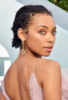 Logan Browning slicked-back natural curly hair