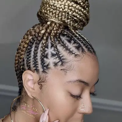 Woman with bun featuring blonde feed-in braids