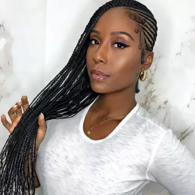 Woman with sideswept long feed-in braids