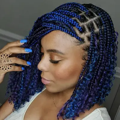 Woman with shoulder-length blue feed-in braids