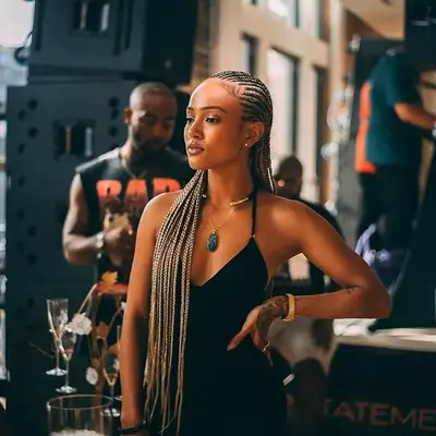 Karrueche Tran wears long cornrowed feed-in braids