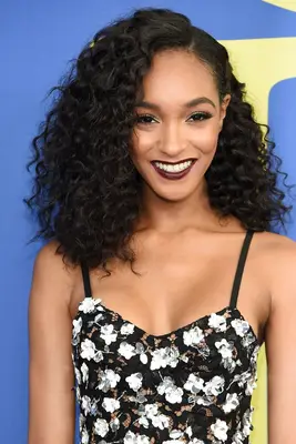 How To Find The Best Part For Your Face Shape 2014: Jourdan Dunn with curly hair and black dress