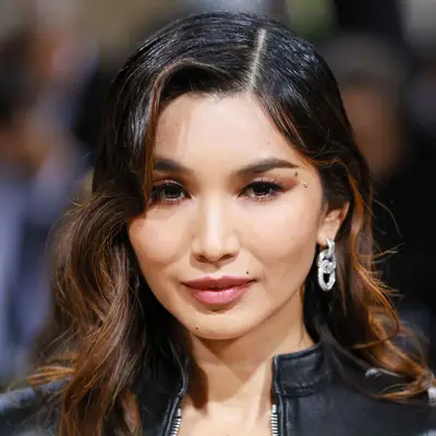 Gemma Chan with black hair and caramel highlights