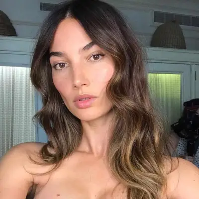 Woman with brown hair and balayage.