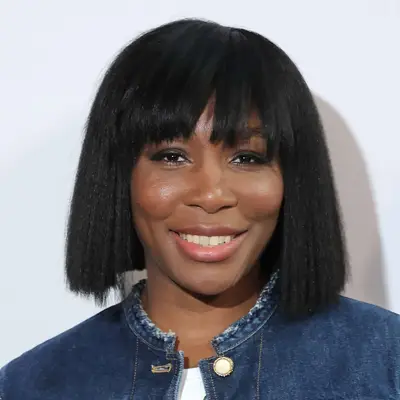 Venus Williams at fashion week in a bobbed wig with long bangs