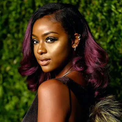 Justine Skye with plum Auburn Brown Hair Color 