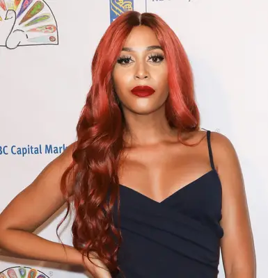 Isis King with red ombré hair